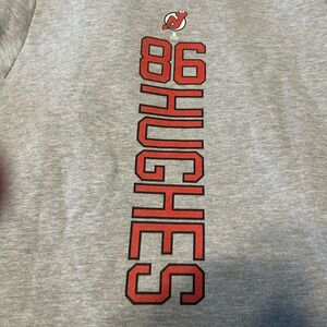NJ Devils hockey hoodie featuring Jack Hugh’s name and number on back.